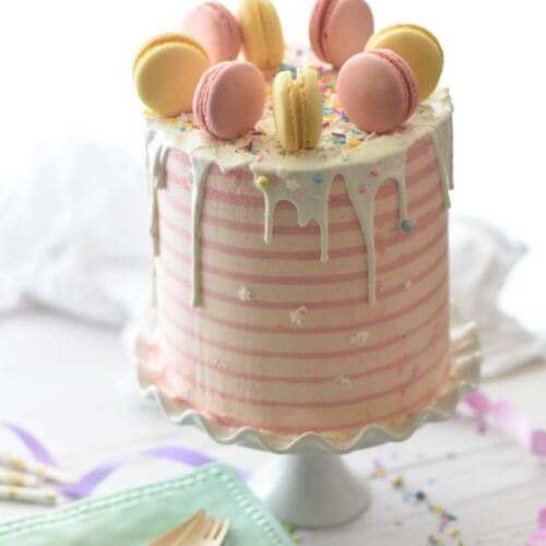 Pink layer cake frosted with American mock meringue buttercream