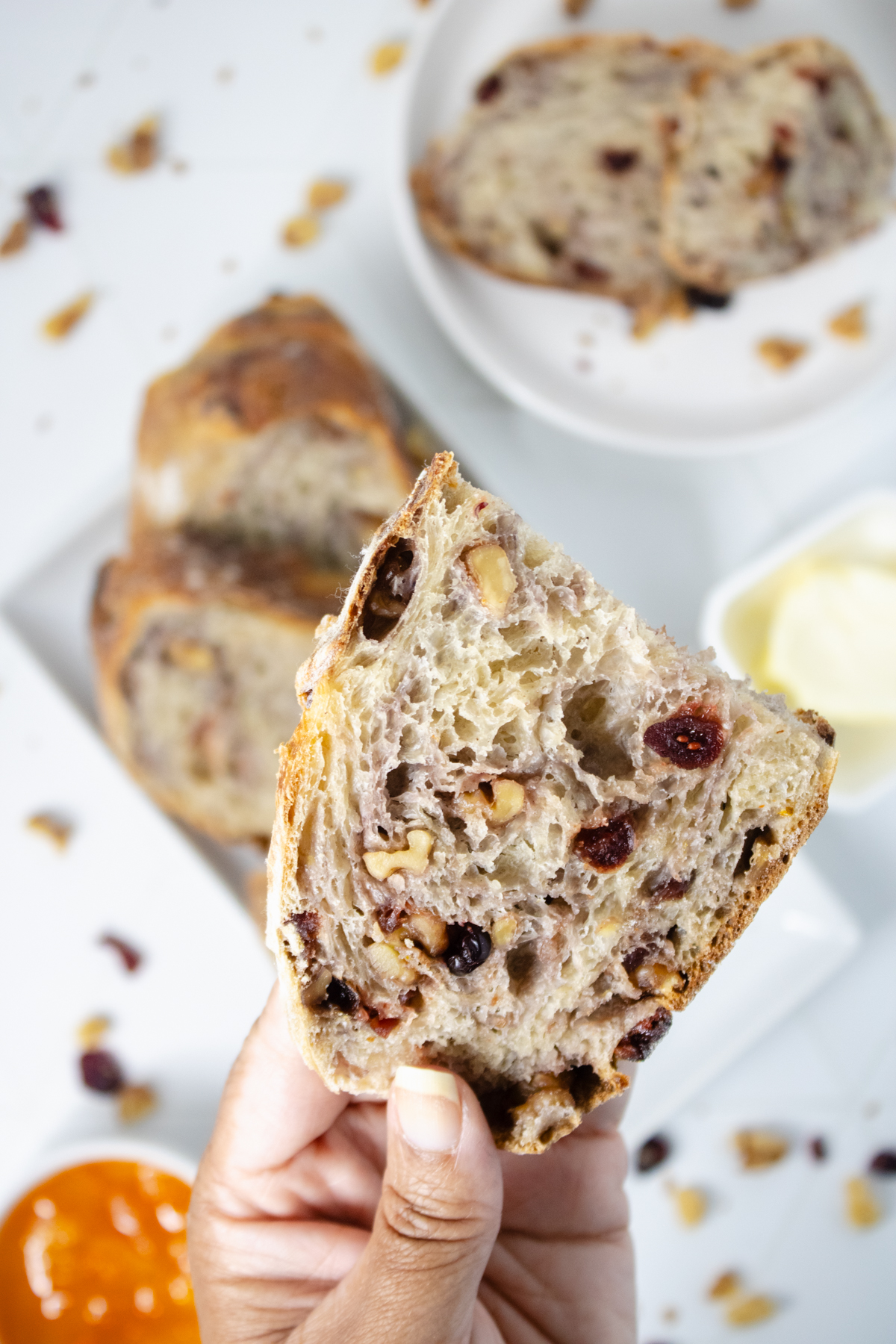 Sliced orange cranberry walnut sourdough bread with cranberries and walnuts